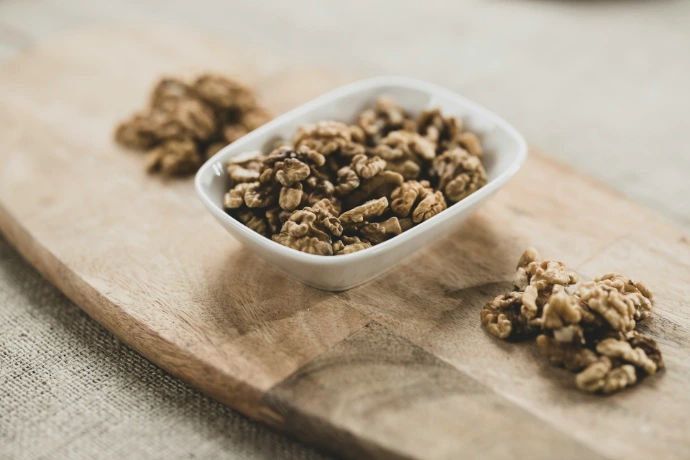 brown peanuts on white ceramic bowl